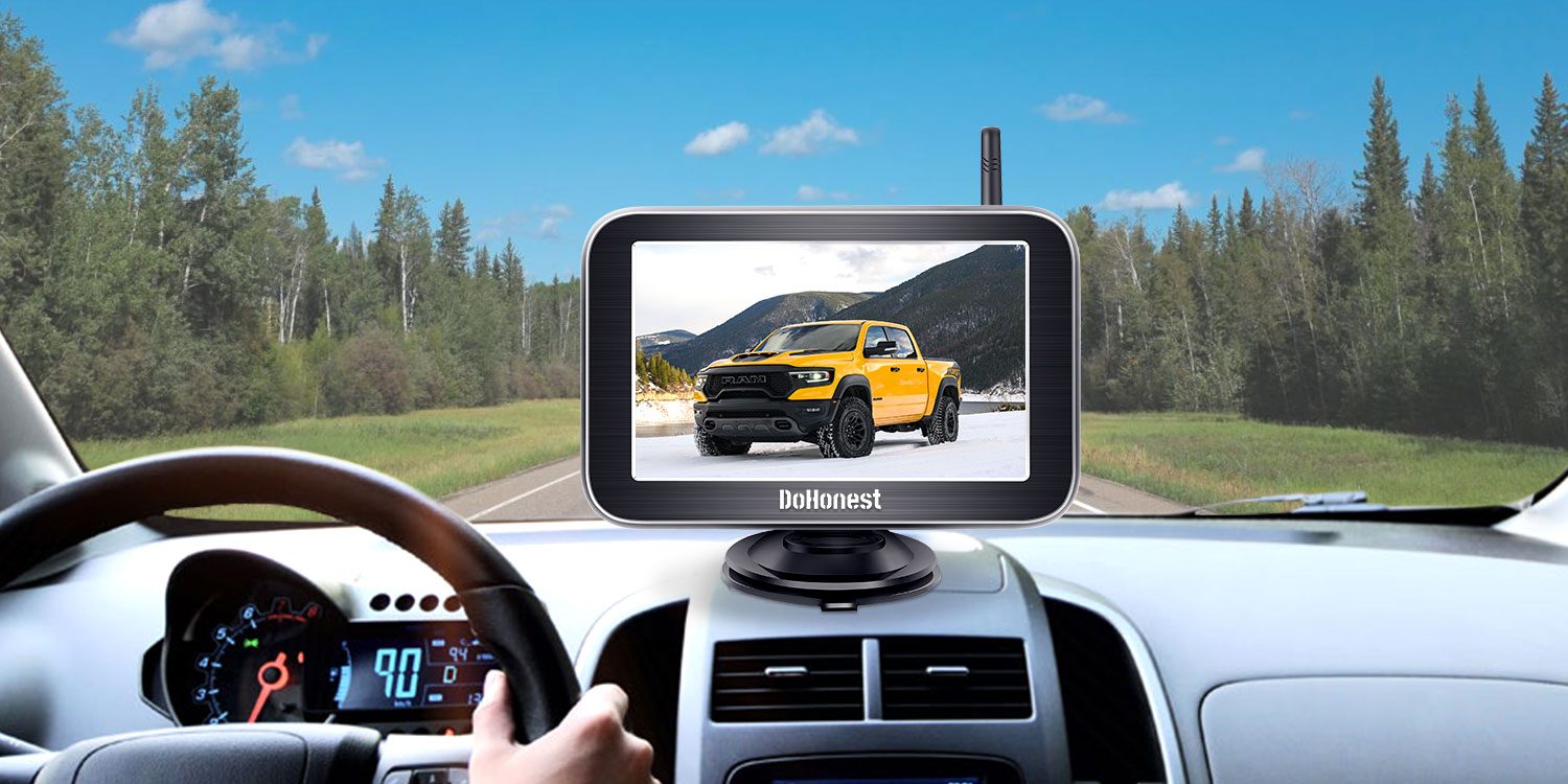 DoHonest wireless backup camera monitor on a dashboard, forest road ahead